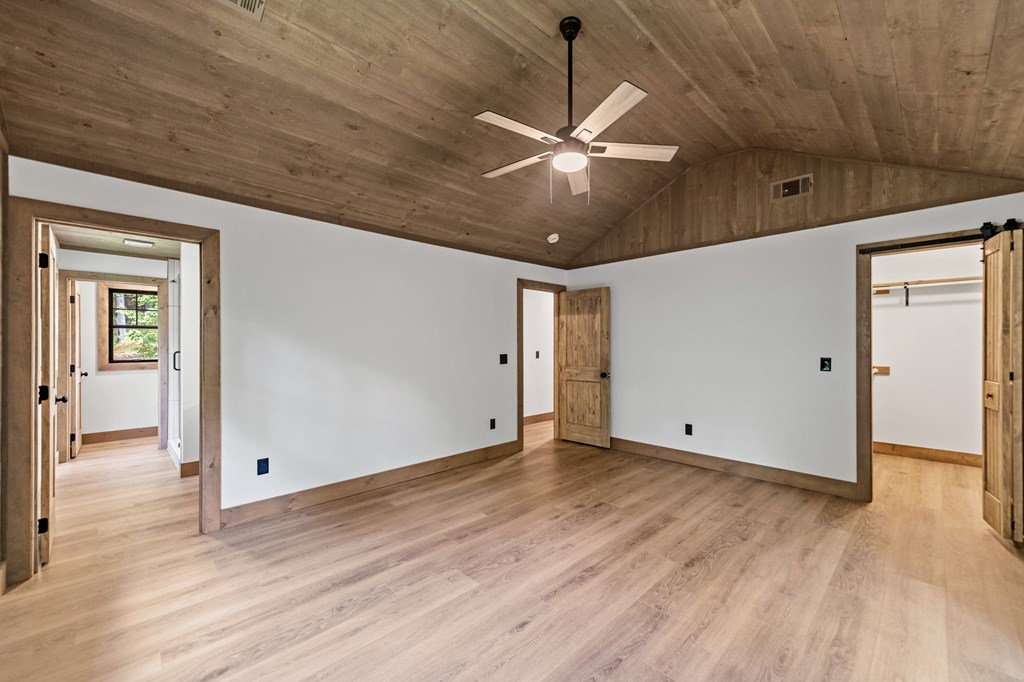570 Cabin Trail Blue Ridge, GA 30513 - Photo 31 of 53 wooden floor in an empty room with a window