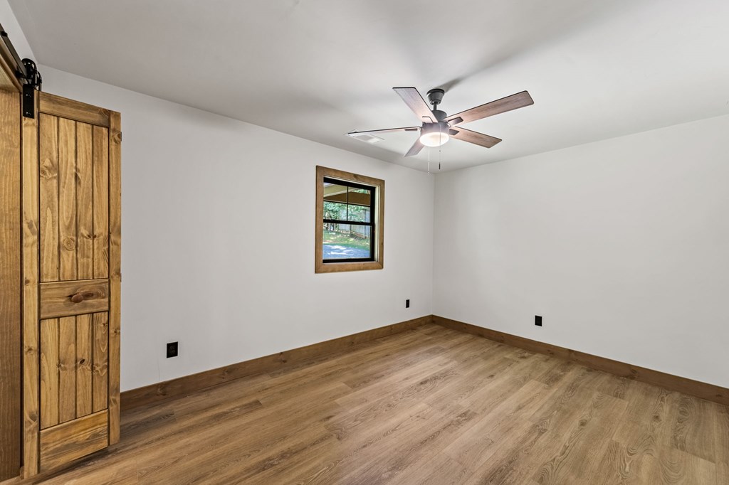 570 Cabin Trail Blue Ridge, GA 30513 - Photo 35 of 53 wooden floor in an empty room with a window
