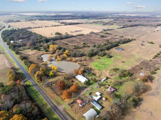 an aerial view of ocean with beach