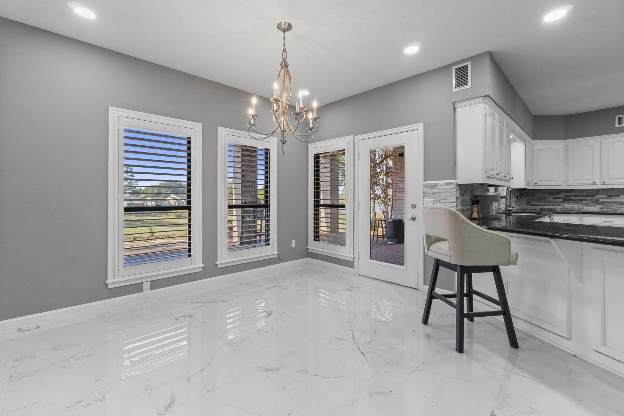22405 Augusta Lane Point Blank, TX 77364 - Photo 11 of 50 a view of a livingroom with furniture a chandelier and window