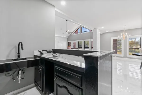 a kitchen with a sink and cabinets