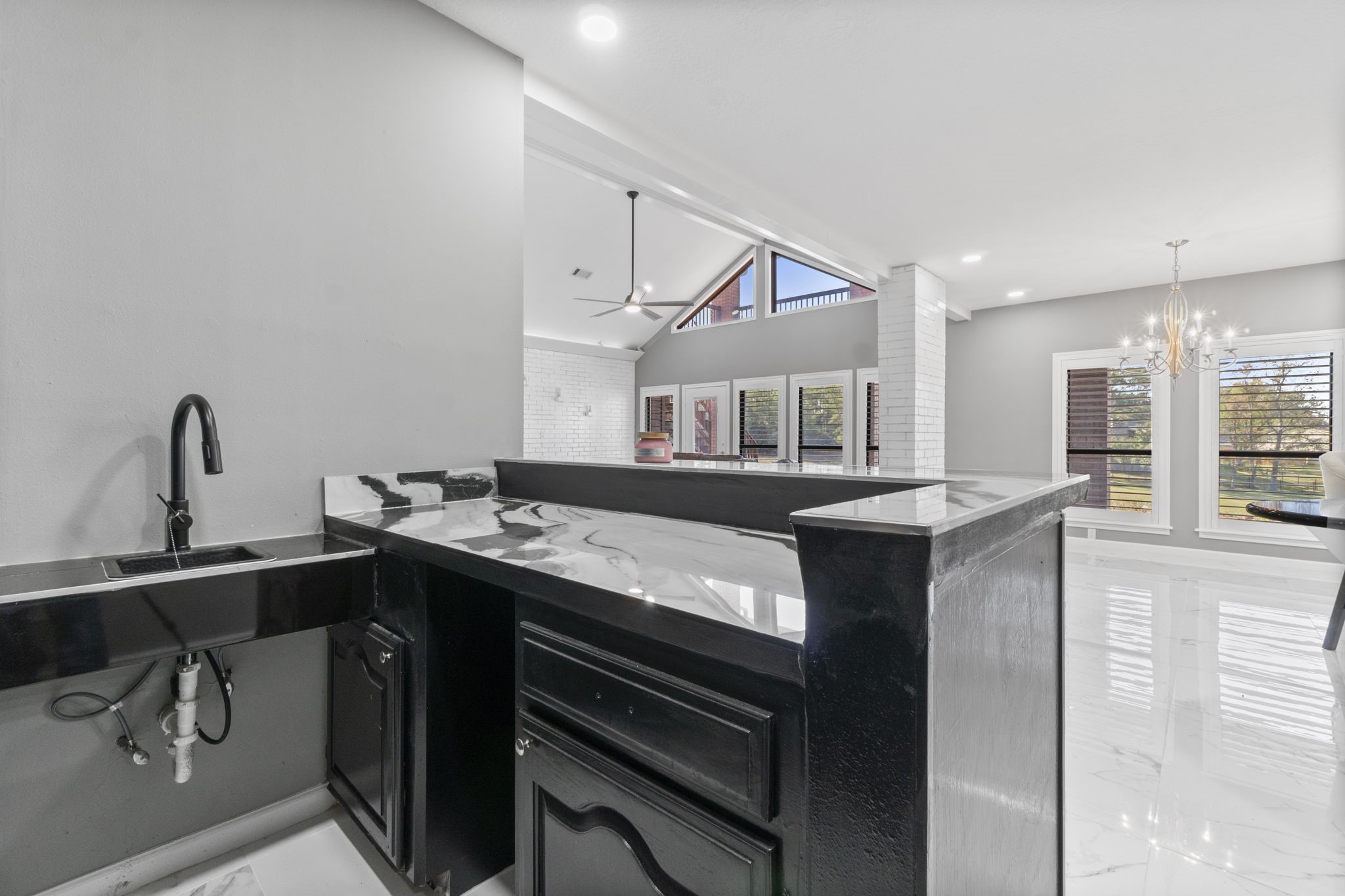 22405 Augusta Lane Point Blank, TX 77364 - Photo 14 of 50 a kitchen with a sink and cabinets