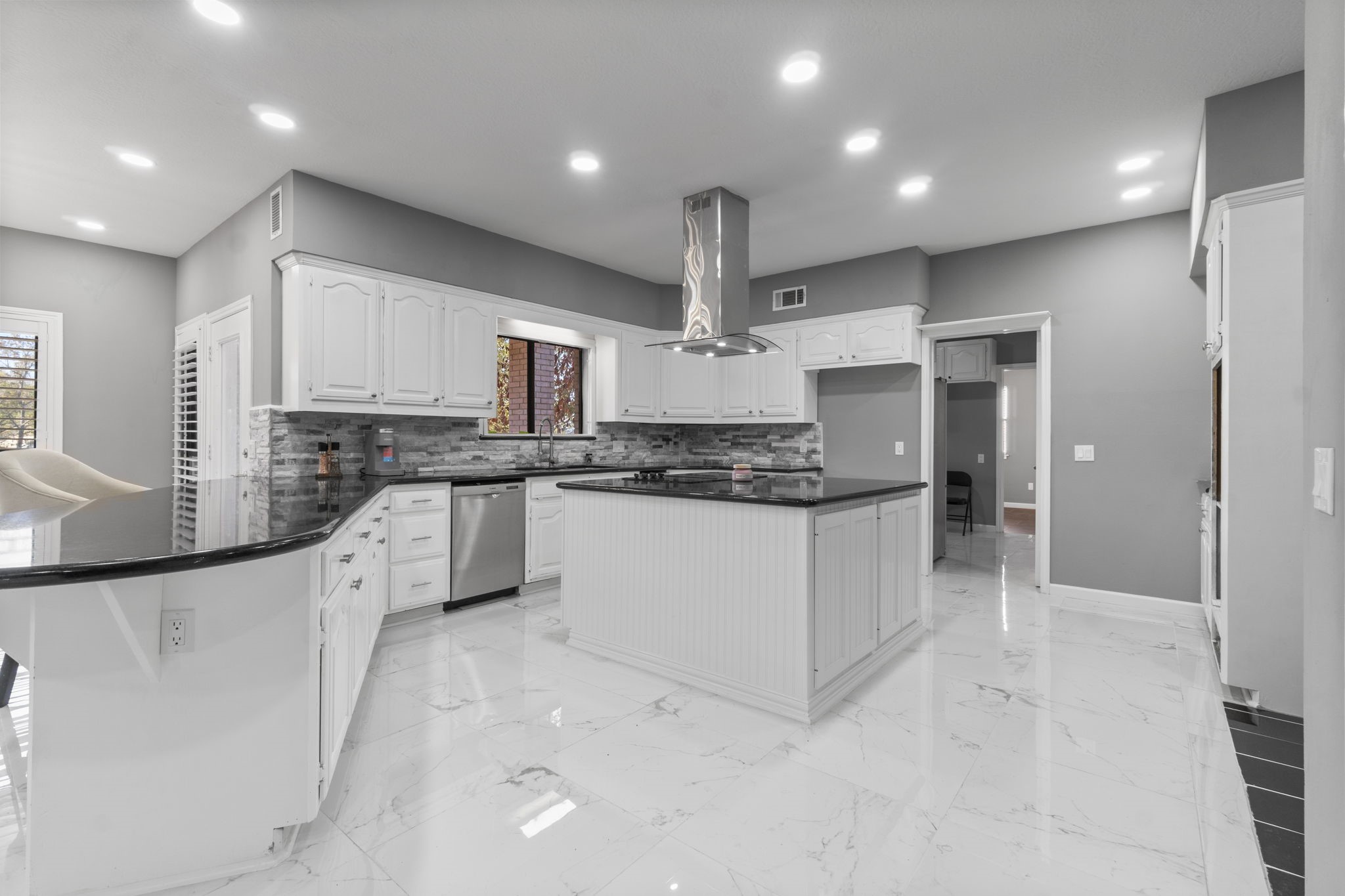 22405 Augusta Lane Point Blank, TX 77364 - Photo 15 of 50 a large kitchen with stainless steel appliances cabinets a sink and a counter top space