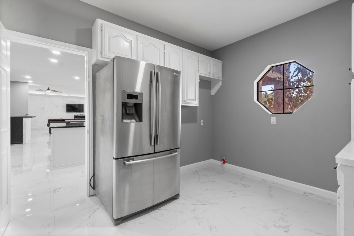 22405 Augusta Lane Point Blank, TX 77364 - Photo 17 of 50 a kitchen with stainless steel appliances granite countertop a refrigerator and a sink