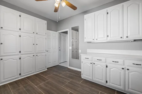 a view of a livingroom with kitchen appliances