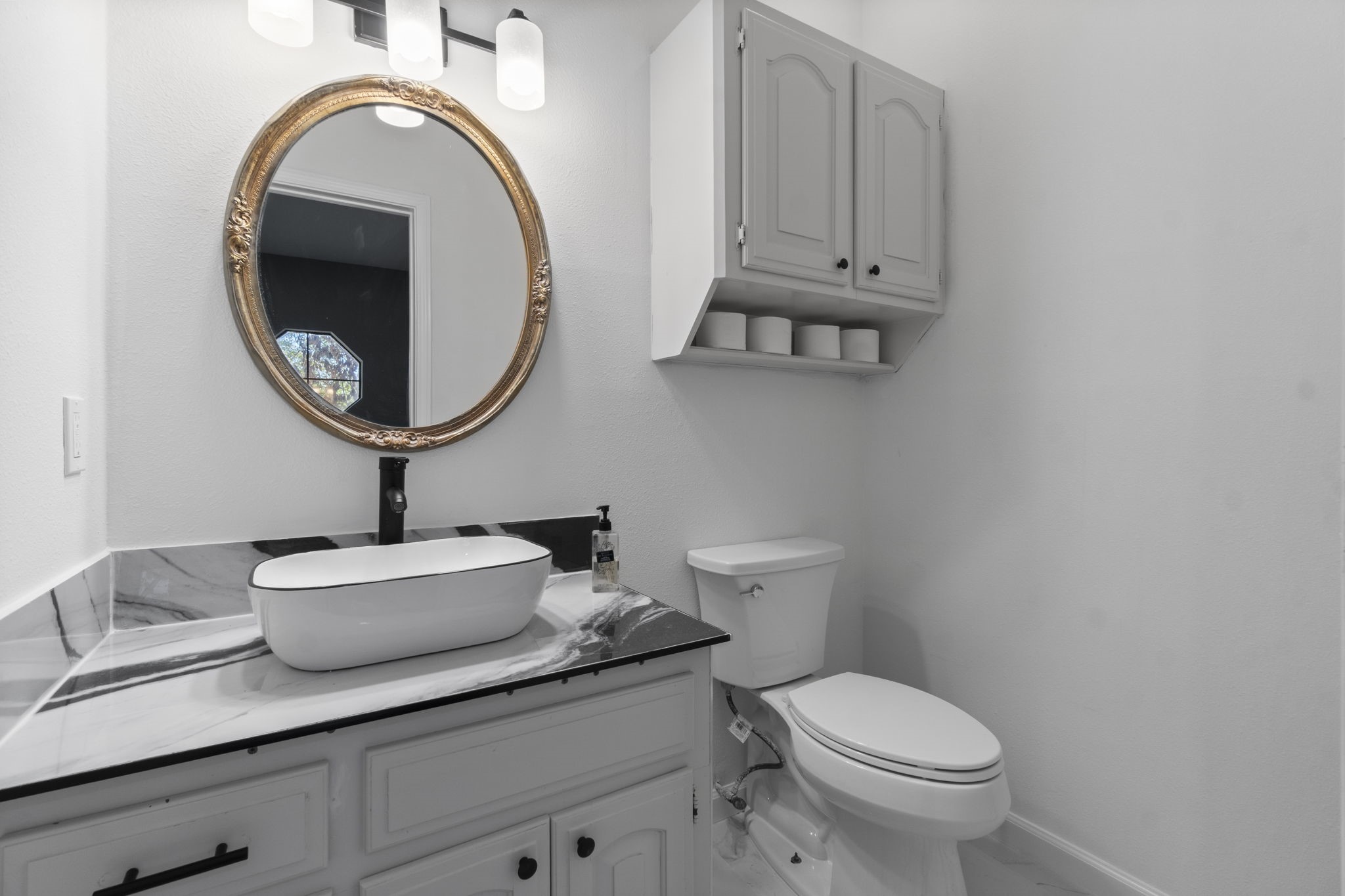22405 Augusta Lane Point Blank, TX 77364 - Photo 20 of 50 a bathroom with a toilet sink and mirror