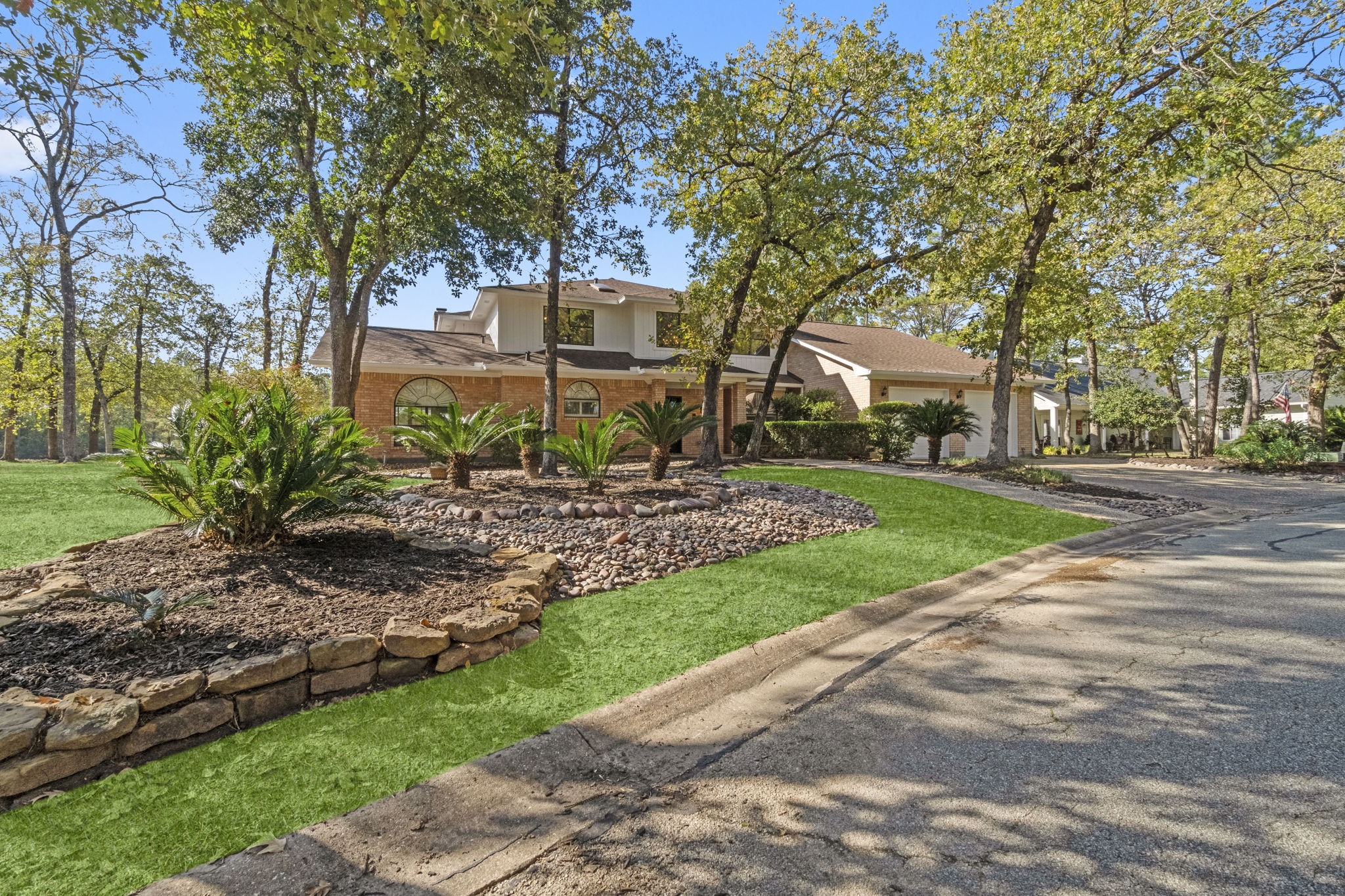 22405 Augusta Lane Point Blank, TX 77364 - Photo 2 of 50 a view of a house with a yard