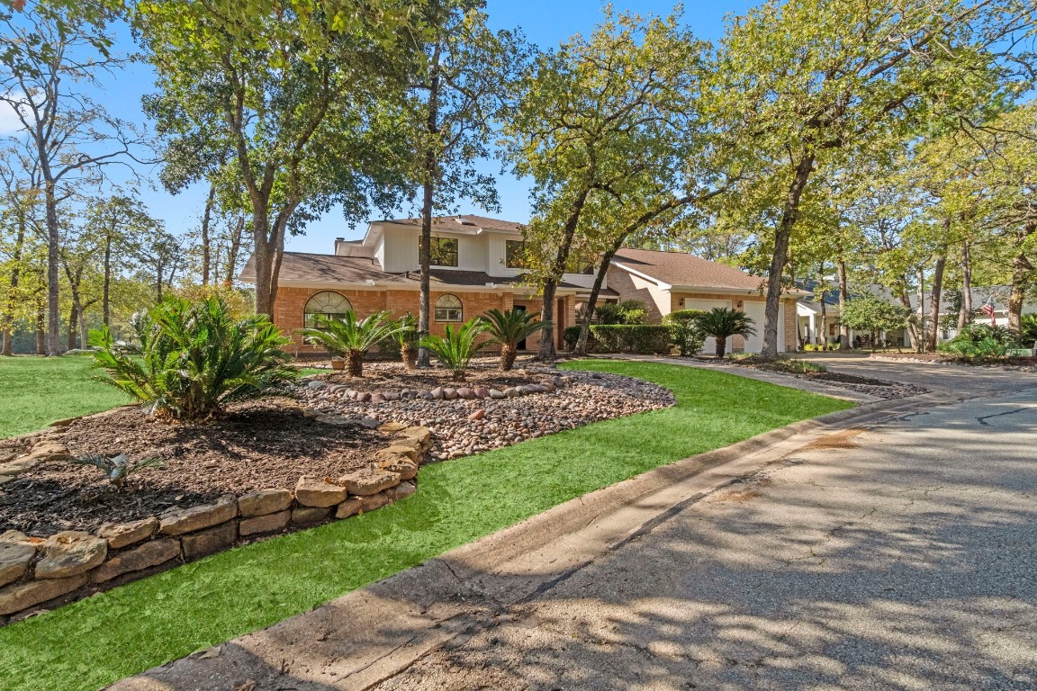 22405 Augusta Lane Point Blank, TX 77364 - Photo 2 of 50 a view of a backyard with a garden