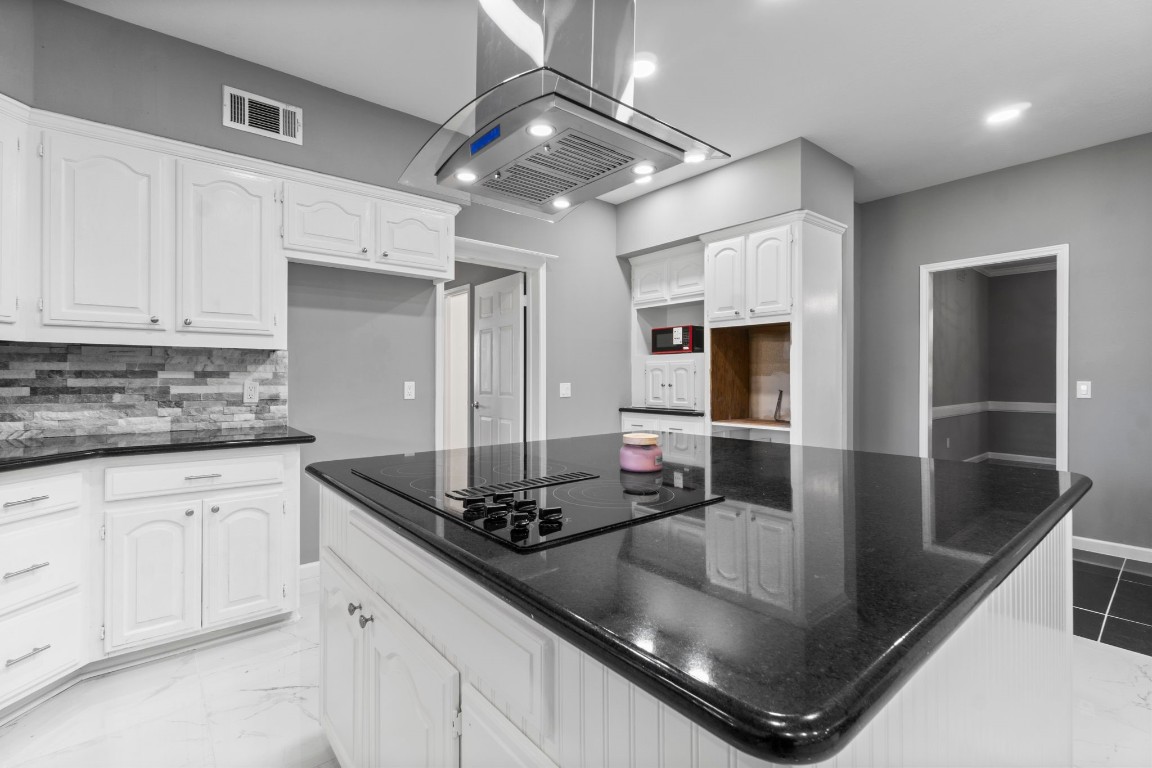 22405 Augusta Lane Point Blank, TX 77364 - Photo 21 of 50 a kitchen with stainless steel appliances granite countertop a sink stove and cabinets