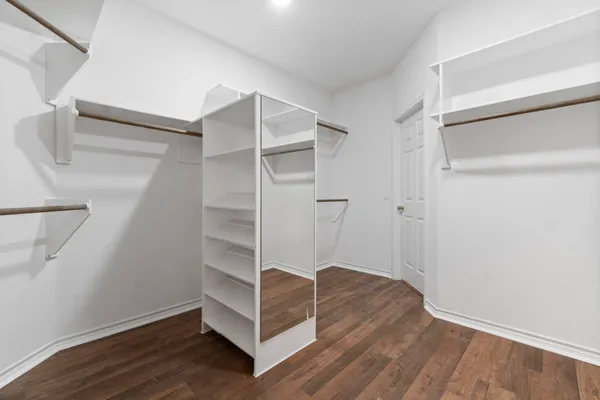 a view of an empty walk in closet