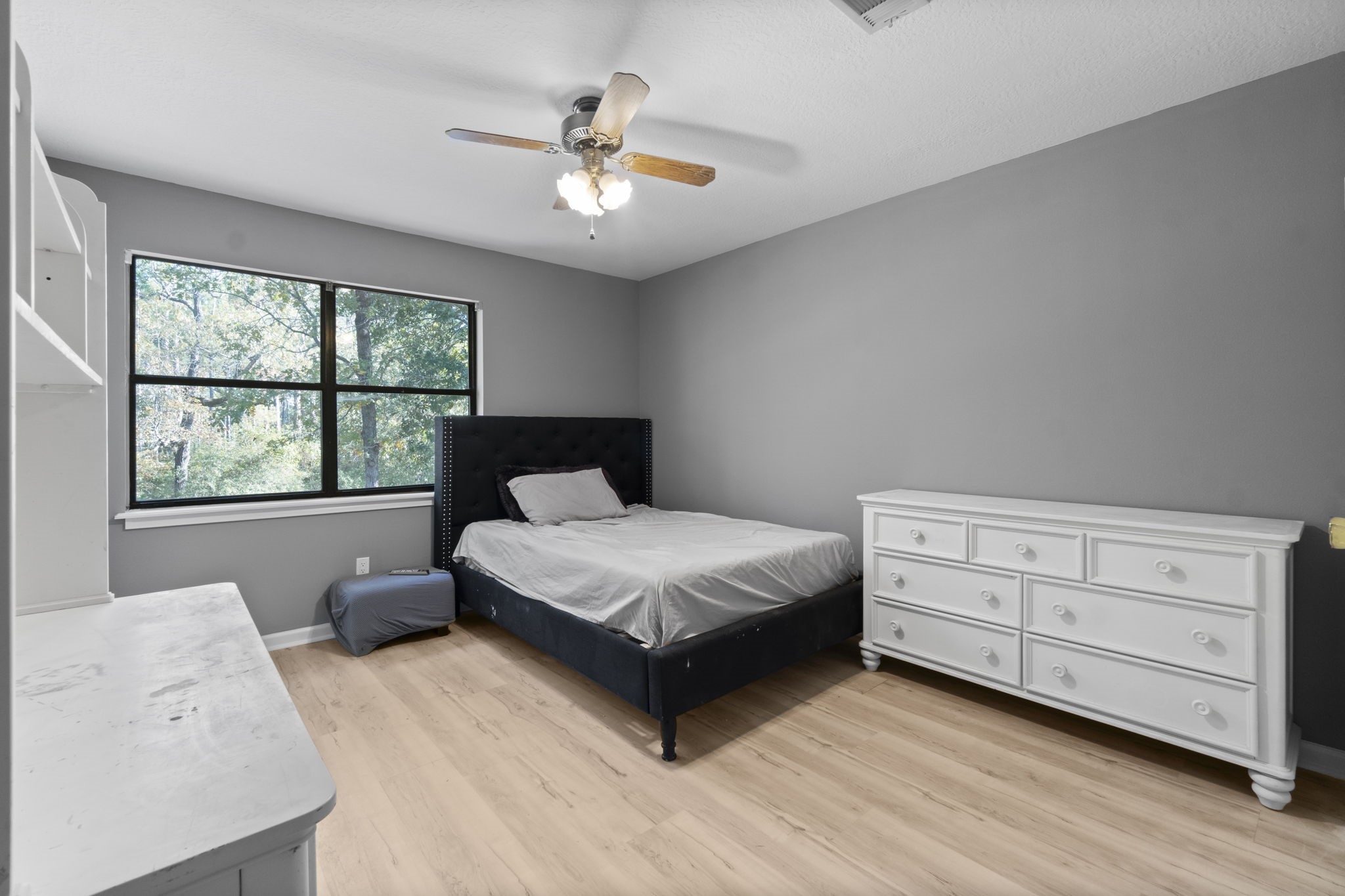 22405 Augusta Lane Point Blank, TX 77364 - Photo 30 of 50 a bedroom with a bed and window