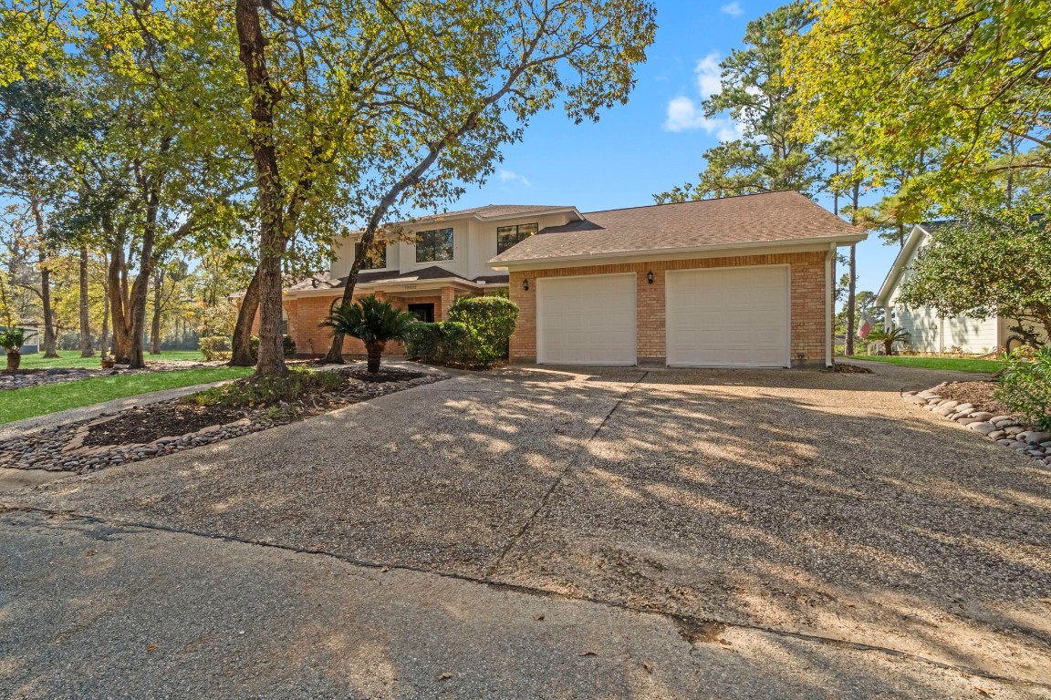 22405 Augusta Lane Point Blank, TX 77364 - Photo 3 of 50 a view of a house with a outdoor space