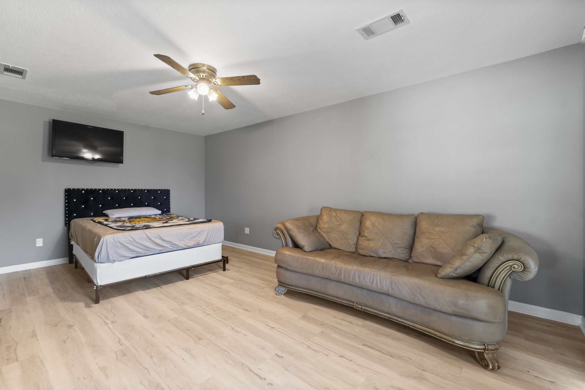 22405 Augusta Lane Point Blank, TX 77364 - Photo 32 of 50 a living room with furniture and a flat screen tv