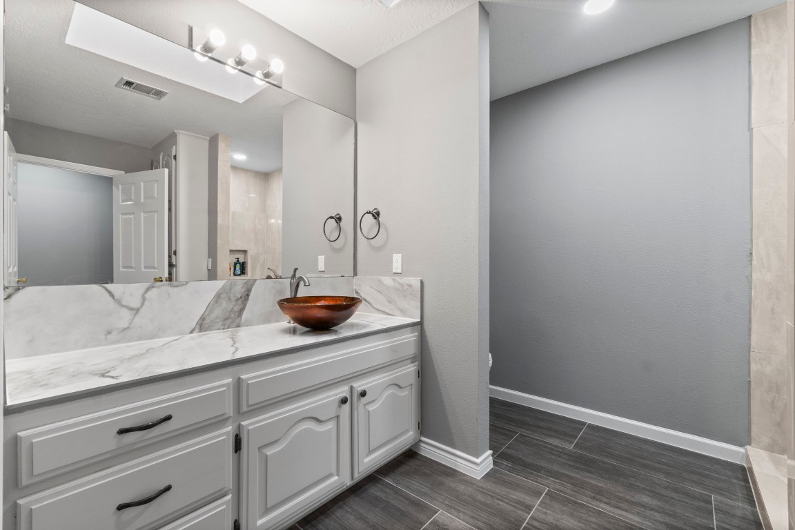 22405 Augusta Lane Point Blank, TX 77364 - Photo 33 of 50 a bathroom with a sink and a mirror