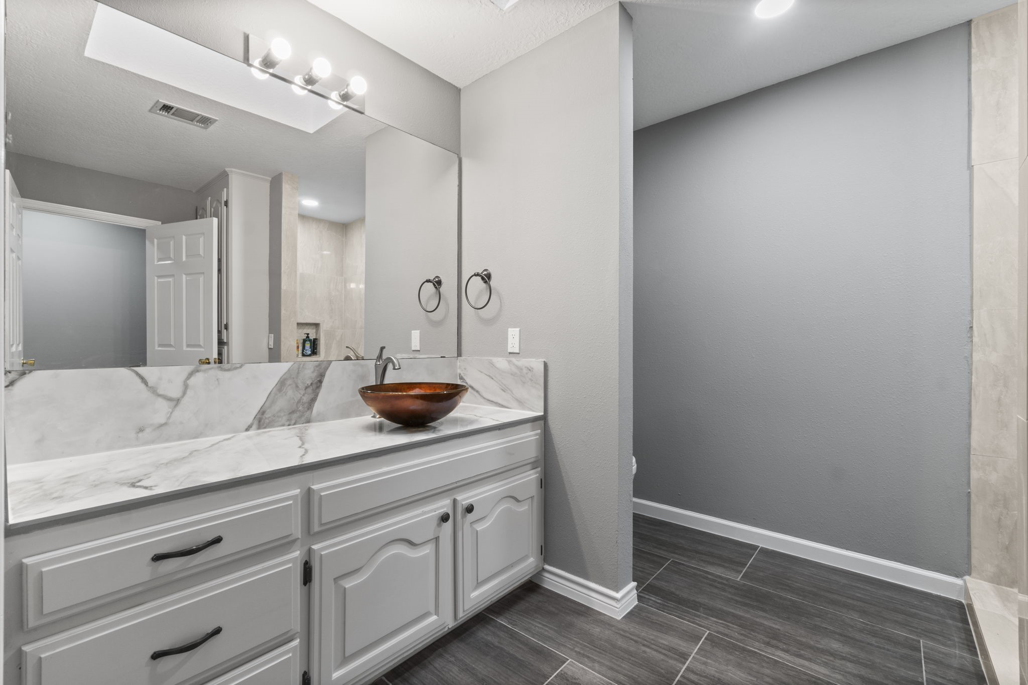 22405 Augusta Lane Point Blank, TX 77364 - Photo 33 of 50 a bathroom with a sink and a mirror