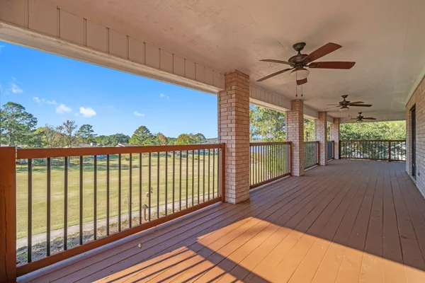 a view of a balcony with wooden floor