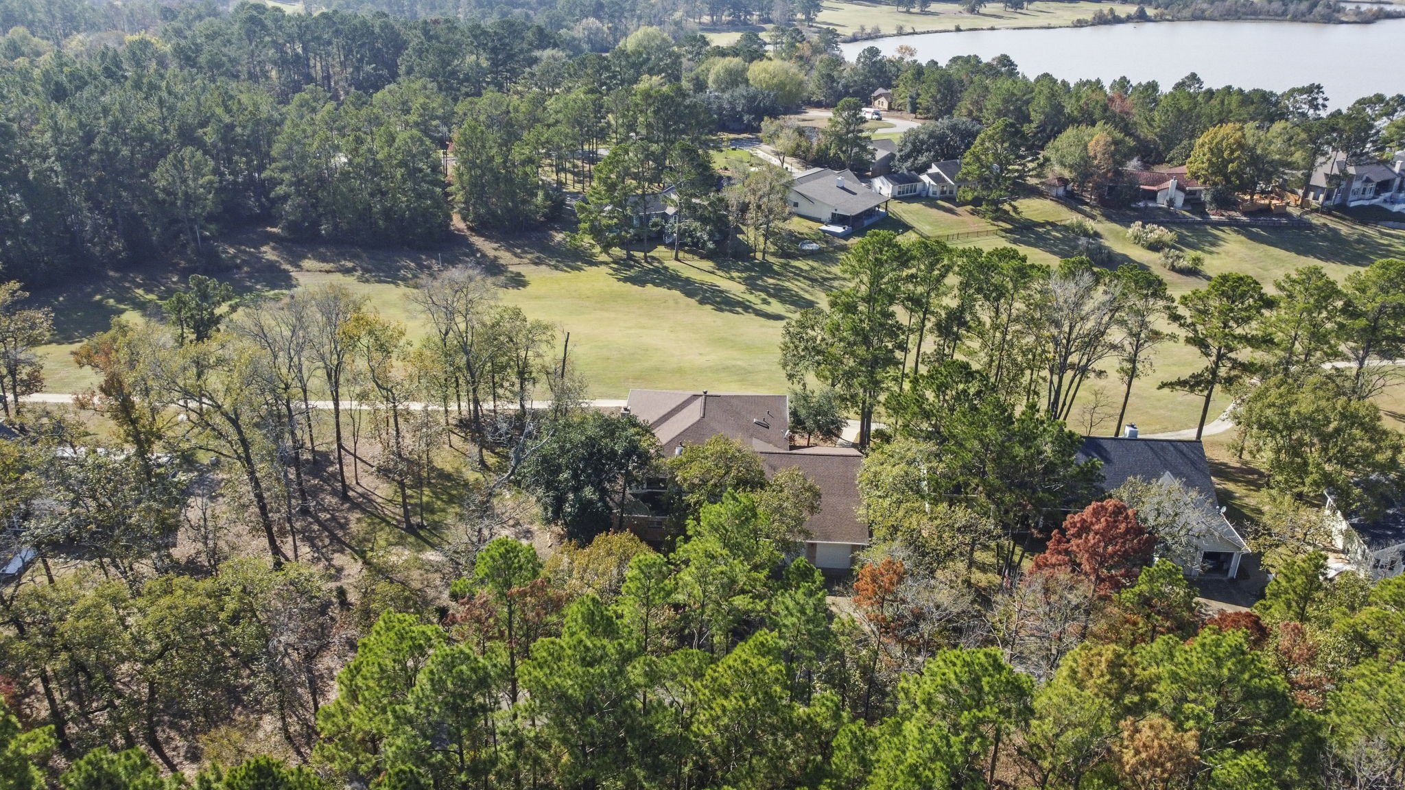 22405 Augusta Lane Point Blank, TX 77364 - Photo 46 of 50 an aerial view of residential house with outdoor space and trees all around