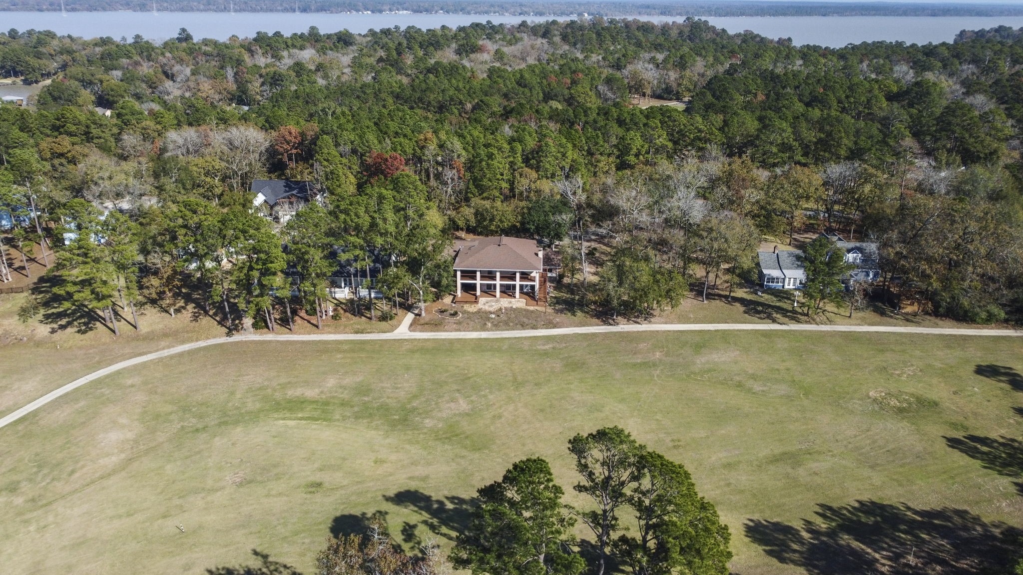 22405 Augusta Lane Point Blank, TX 77364 - Photo 48 of 50 a view of a house with a yard