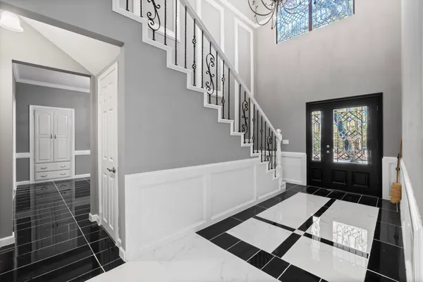 a view of entryway and hall with wooden floor