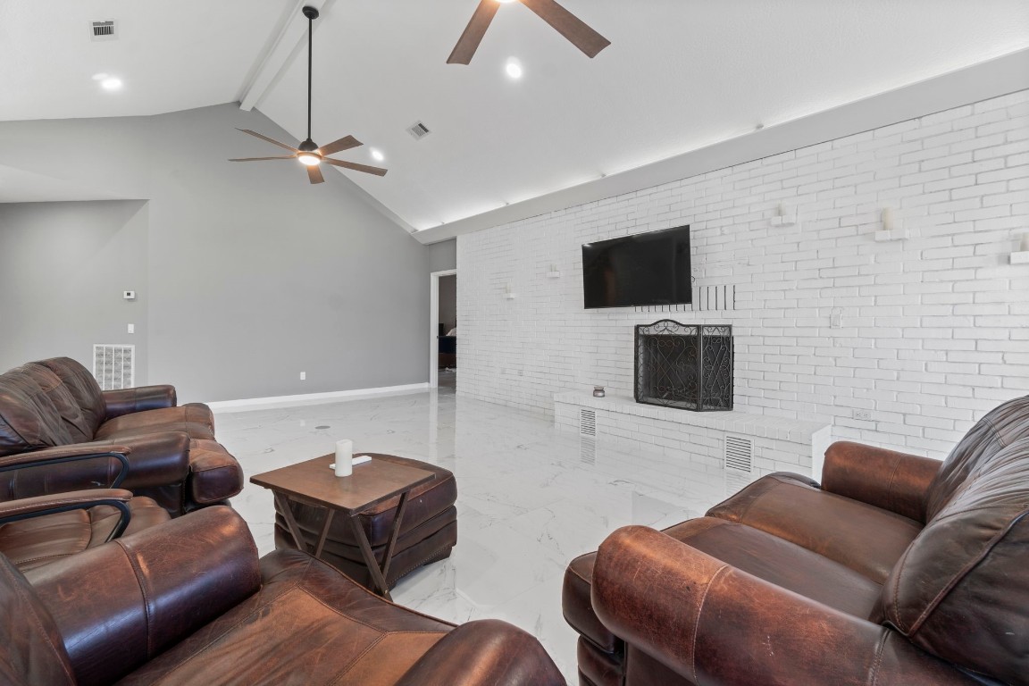22405 Augusta Lane Point Blank, TX 77364 - Photo 10 of 50 a living room with furniture and a flat screen tv