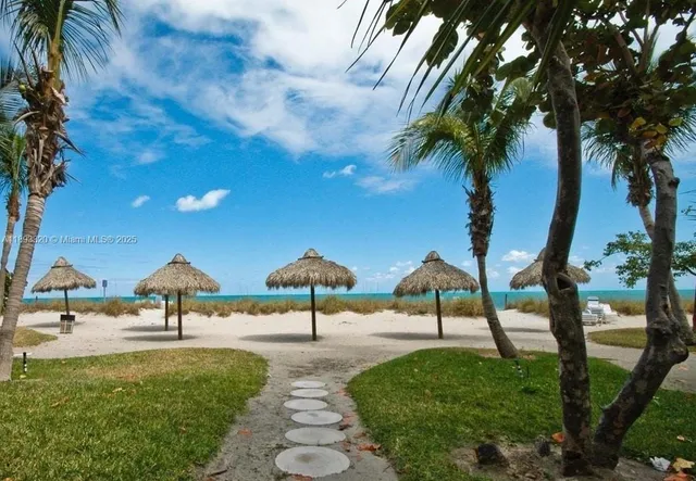 a park with water view and trees