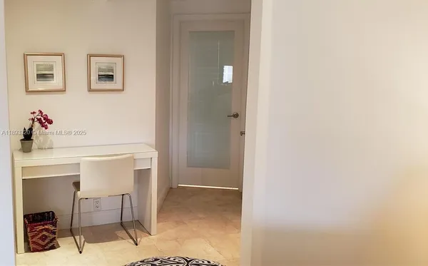 a room with a table and chairs