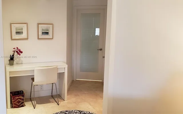 a room with a table and chairs