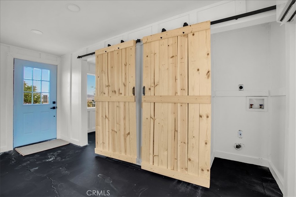 777 Quail Bush Road Landers, CA 92285 - Photo 16 of 46 a view of an entryway with wooden floor