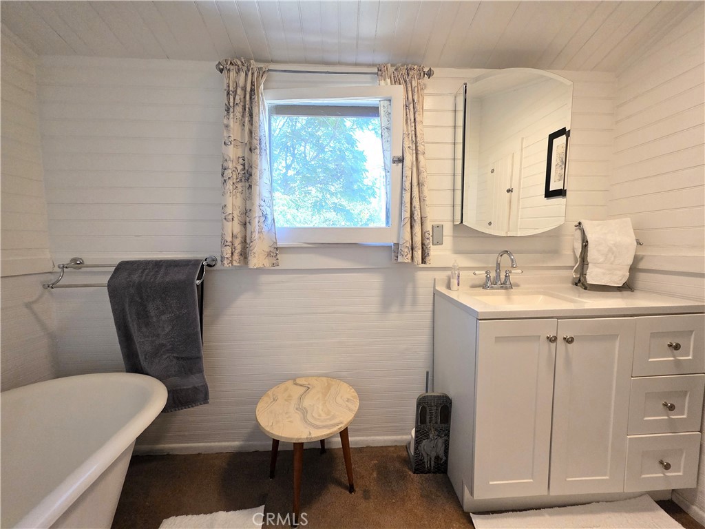 1414 Marin Street Corning, CA 96021 - Photo 15 of 43 a bathroom with a toilet sink and mirror