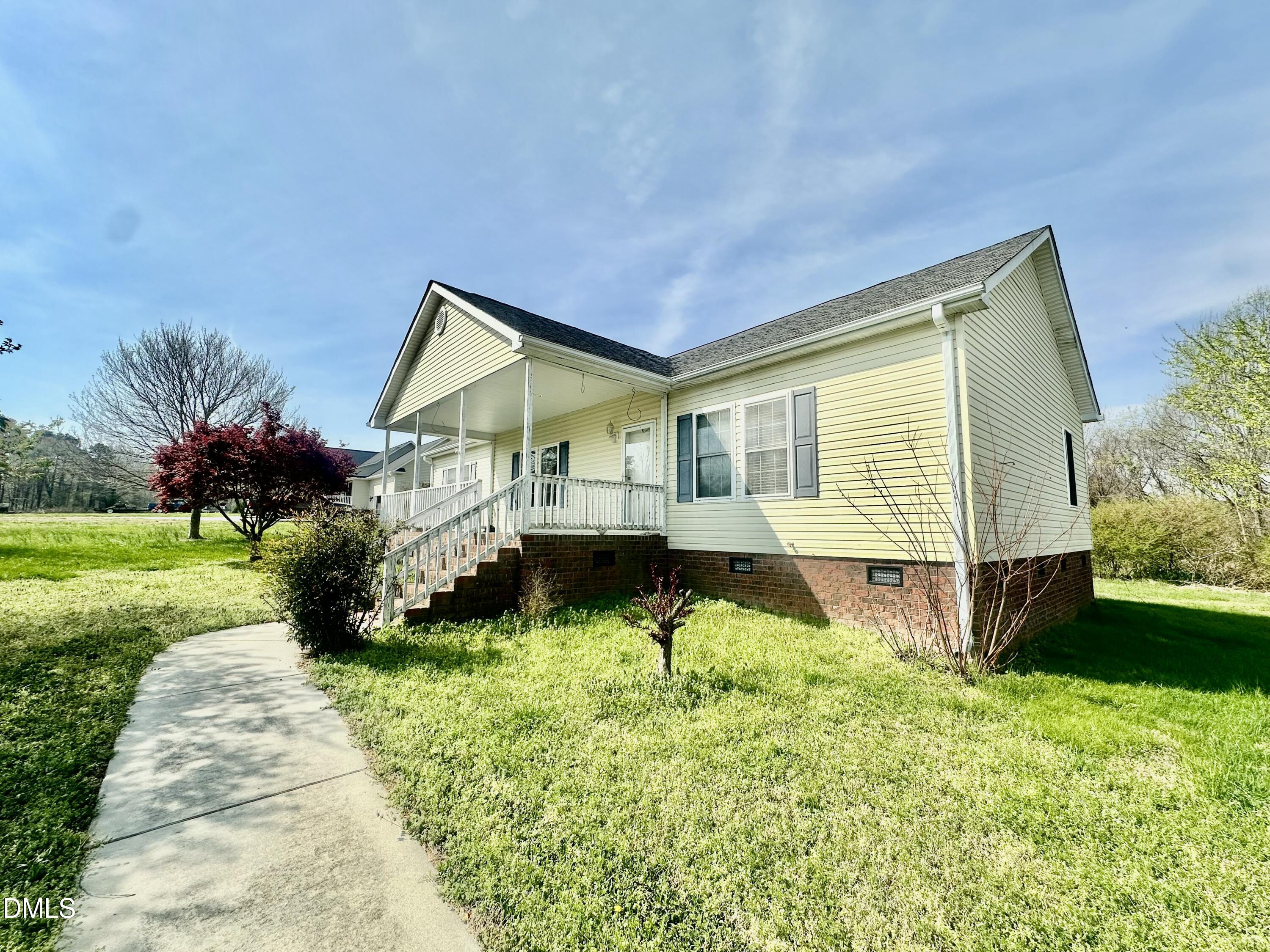 155 Collin Drive Roxboro, NC 27574 - Photo 18 of 20 a front view of house with yard and green space