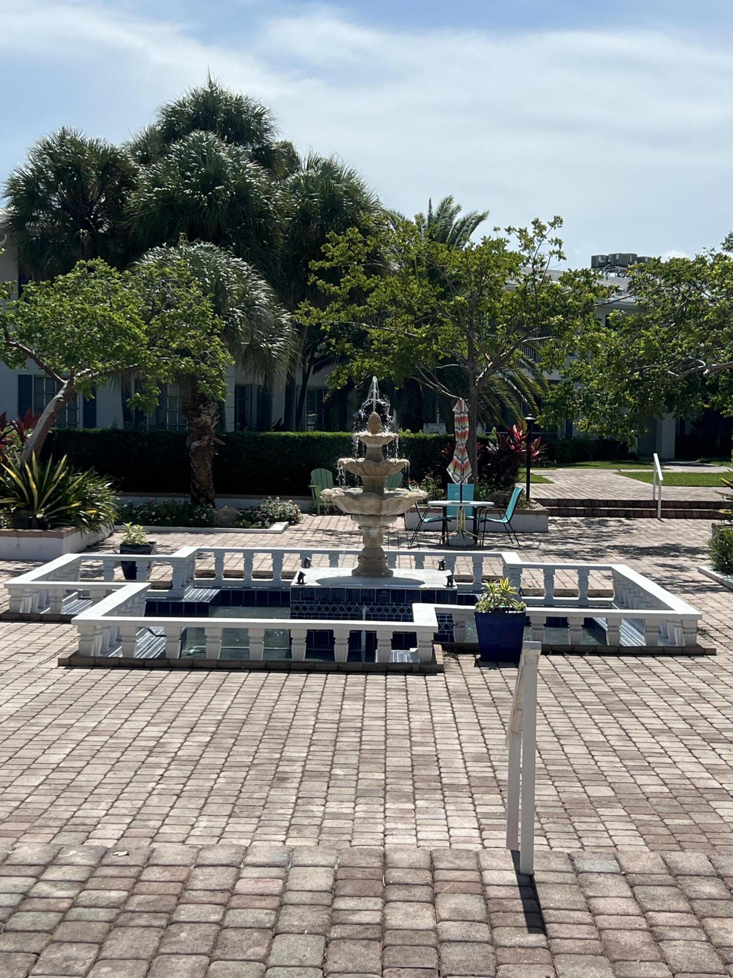 2271 Northeast 68th Street, Unit 2022 Fort Lauderdale, FL 33308 - Photo 17 of 22 a view of a swimming pool with a patio