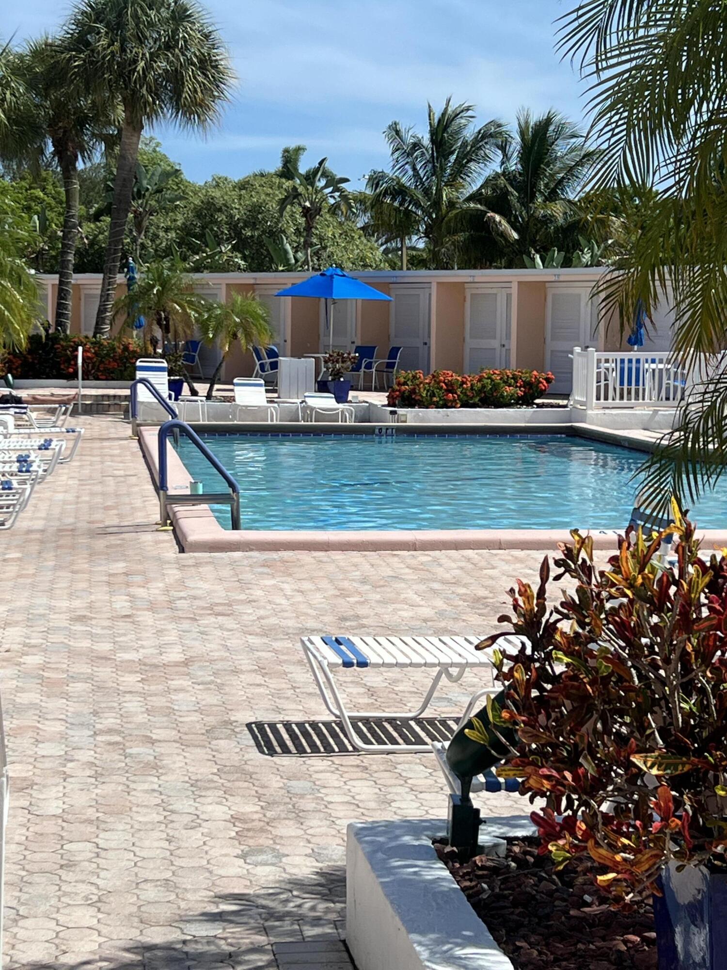 2271 Northeast 68th Street, Unit 2022 Fort Lauderdale, FL 33308 - Photo 18 of 22 a view of a house with a yard patio and sitting area