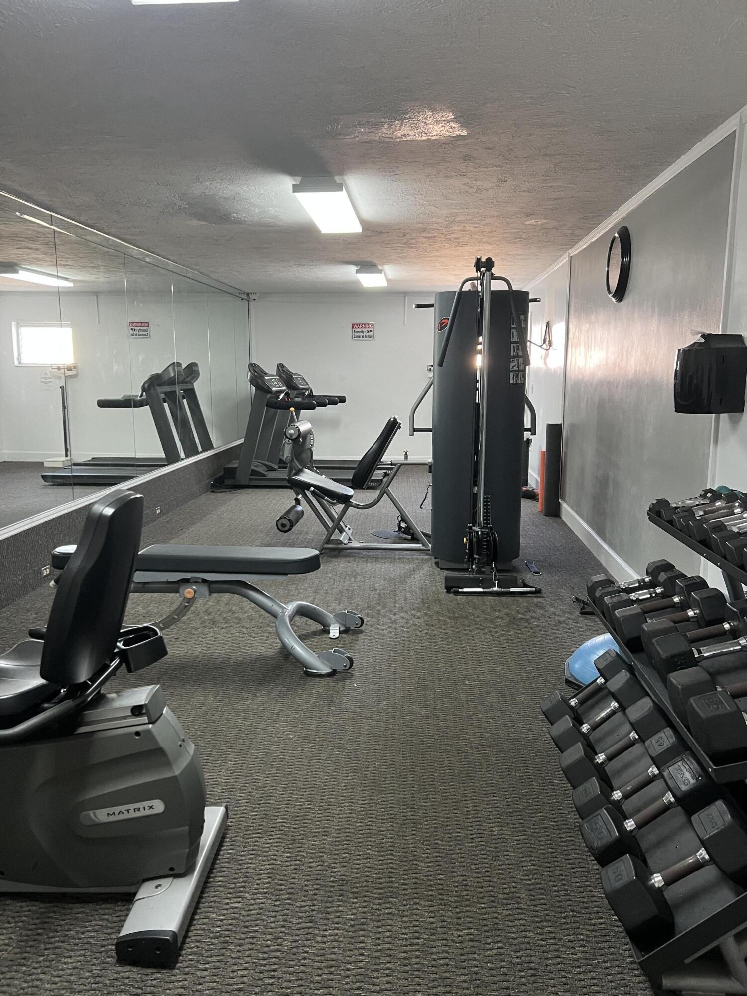 2271 Northeast 68th Street, Unit 2022 Fort Lauderdale, FL 33308 - Photo 22 of 22 a view of a room with gym equipment