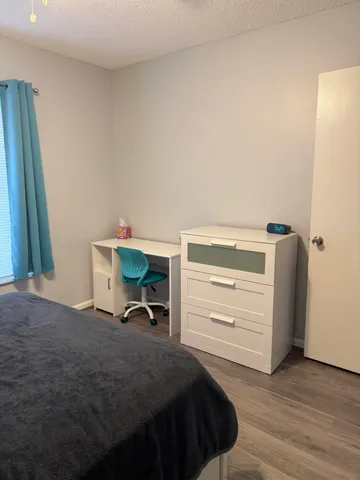 a bedroom with a bed and a closet