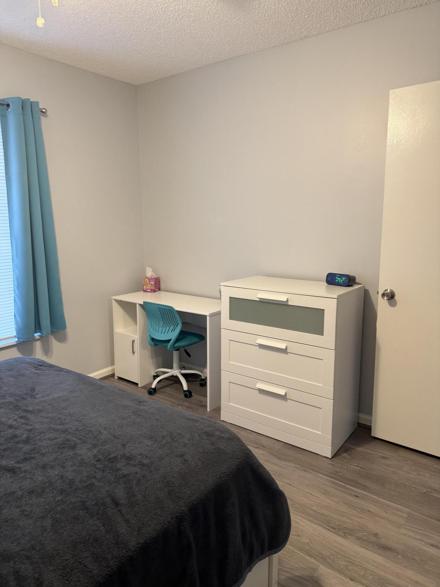 2271 Northeast 68th Street, Unit 2022 Fort Lauderdale, FL 33308 - Photo 10 of 22 a bedroom with a bed and a closet