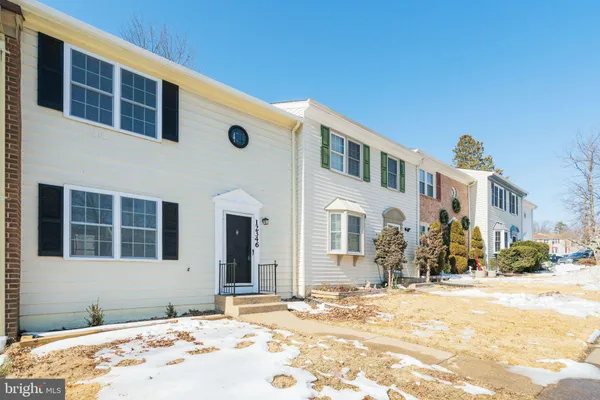 a front view of a house with a snow