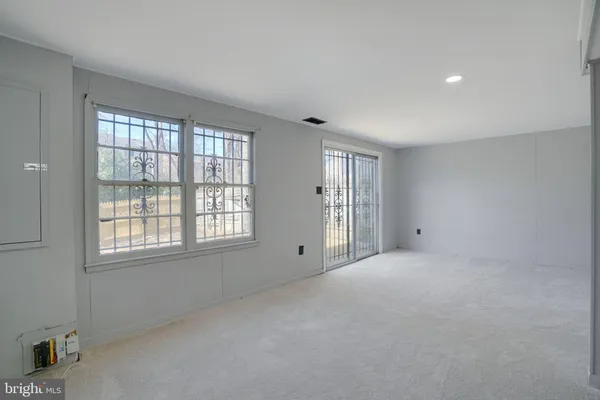 a view of a house with a snow on the road