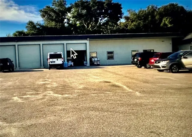 a view of car parked in front of garage