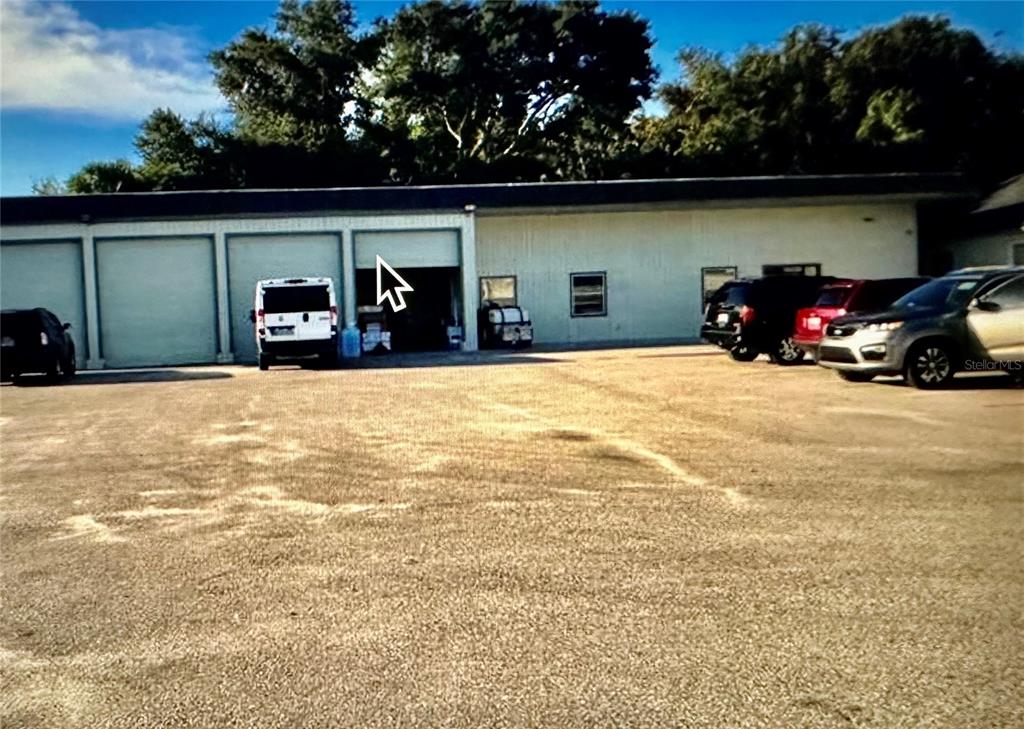 801 Marshall Farms Road Ocoee, FL 34761 - Photo 3 of 16 a view of car parked in front of garage