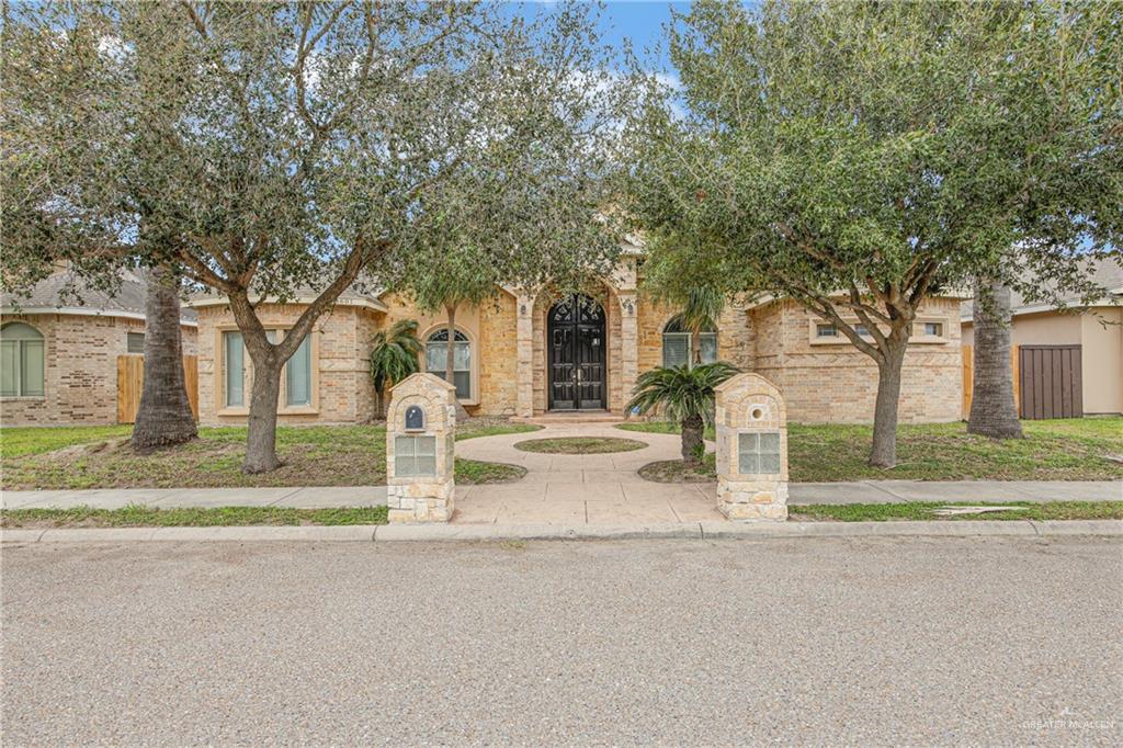 3601 North Toledo Street Pharr, TX 78577 - Photo 1 of 21 a house with trees in front of it