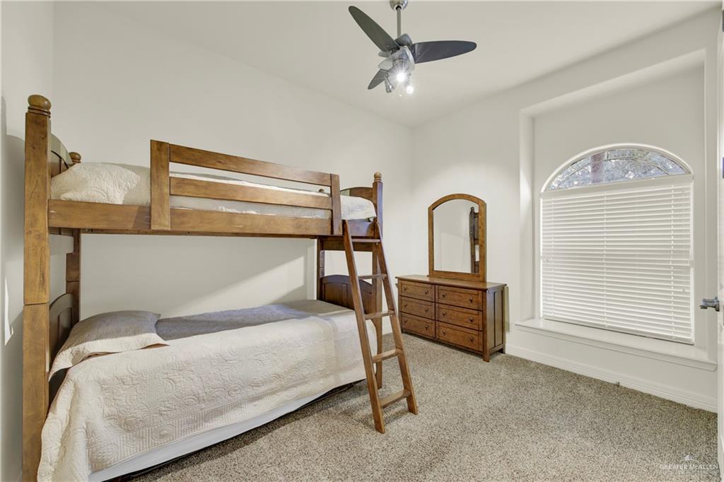 3601 North Toledo Street Pharr, TX 78577 - Photo 11 of 21 a bedroom with a bed and a dresser