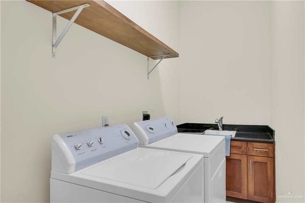 3601 North Toledo Street Pharr, TX 78577 - Photo 10 of 21 a utility room with dryer and washer
