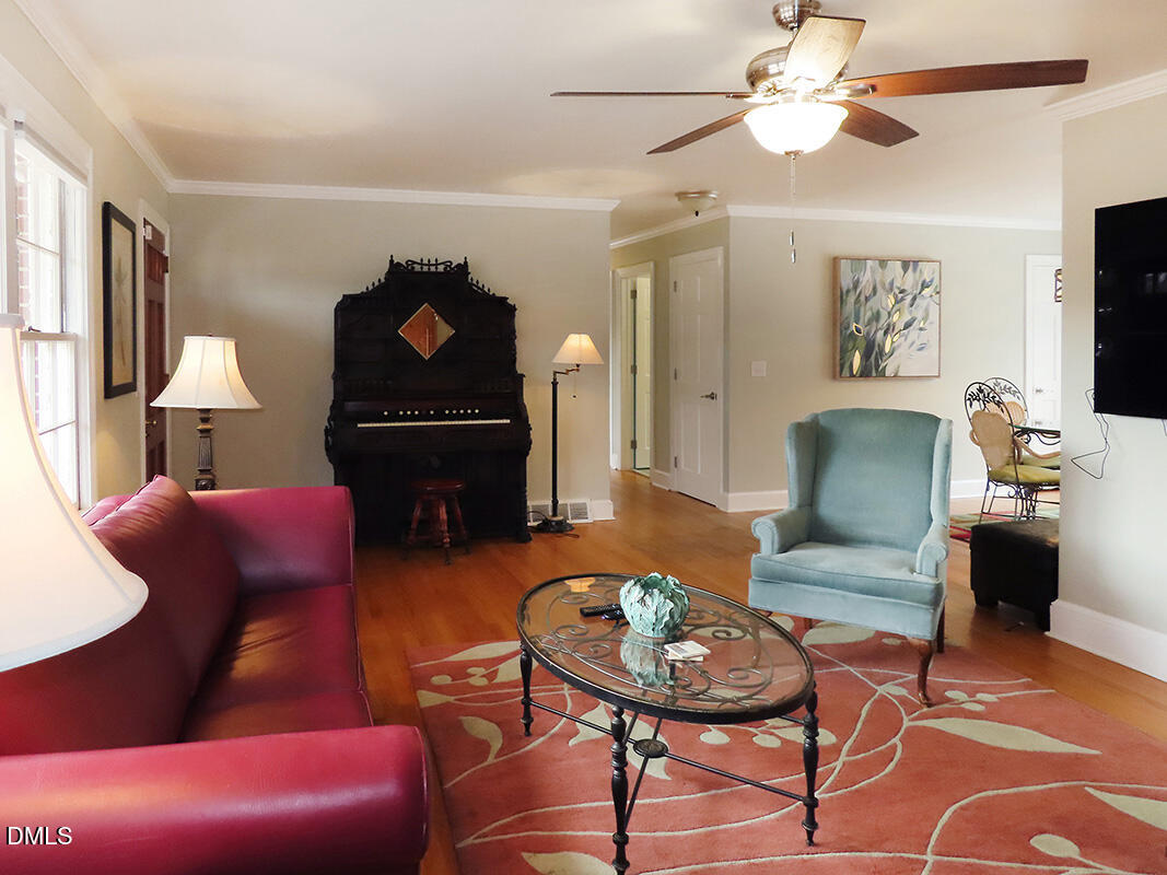8743 Highway 751 Durham, NC 27713 - Photo 3 of 21 a living room with furniture and a wooden floor