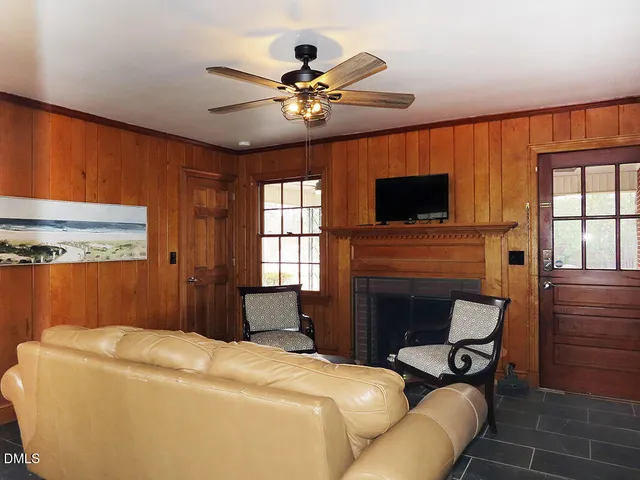 a bedroom with a bed and a fireplace