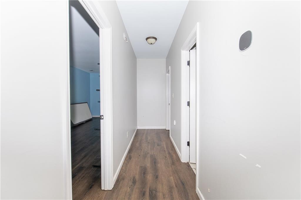 561 Holland Road Dallas, GA 30157 - Photo 32 of 48 a view of a hallway with wooden floor