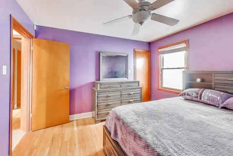 a bedroom with a bed and a dresser