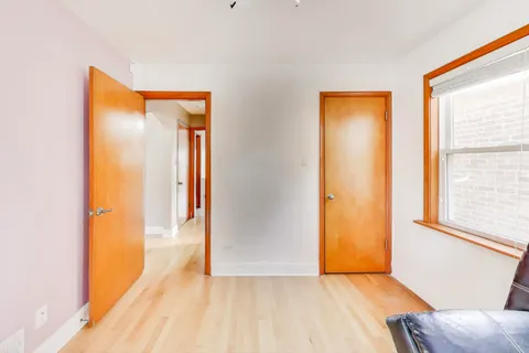 a view of livingroom with hardwood floor and hallway