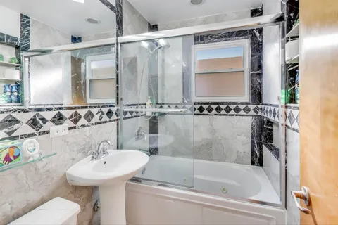 a bathroom with a sink and a bathtub