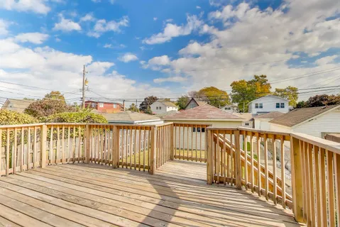 a view of a balcony with wooden floor