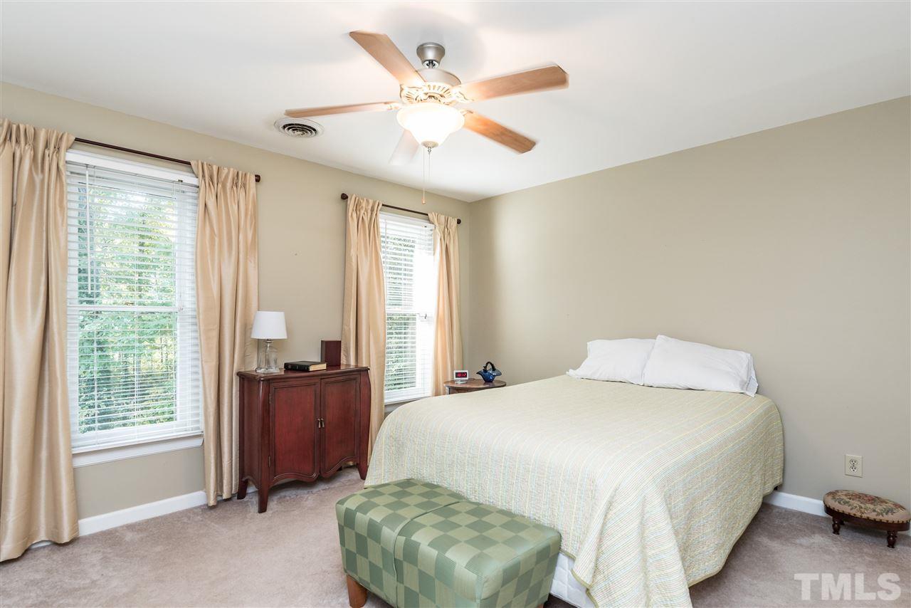 3104 Hickory Road Raleigh, NC 27616 - Photo 17 of 25 a bedroom with a bed and a large window